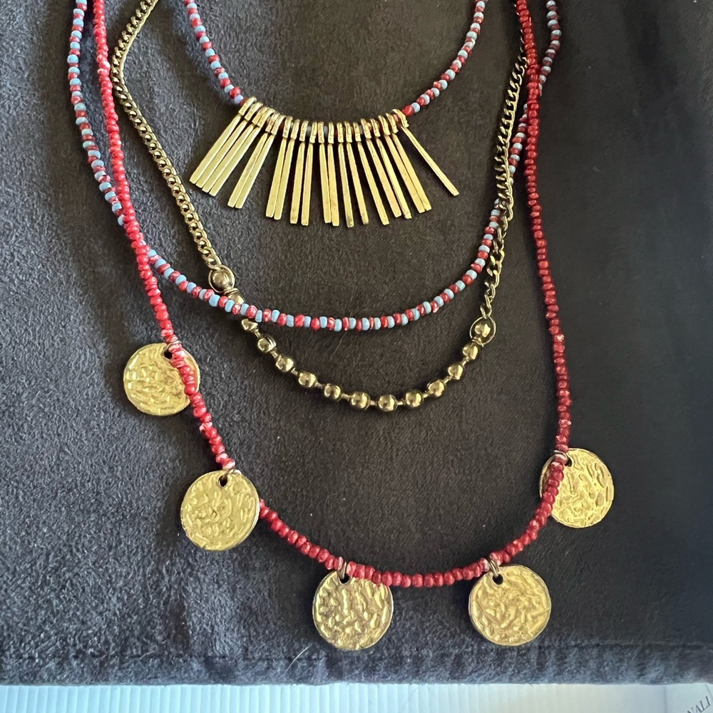 Red layered Necklace with gold accents.